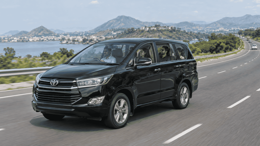 Chauffeur driven car travelling on an Indian highway for an outstation trip